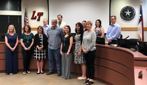 Lake Travis ISD board of trustee members stand with the 2019-20 teachers of the year.