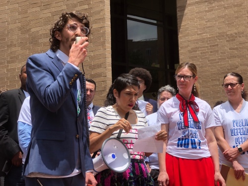 Nicolas Sawyer, a student at The University of Texas School of Law, speaks during a press conference in support of the public defender's office held by local nonprofit Grassroots Leadership on the steps of the Travis County Administration Building in Austin on May 7. 