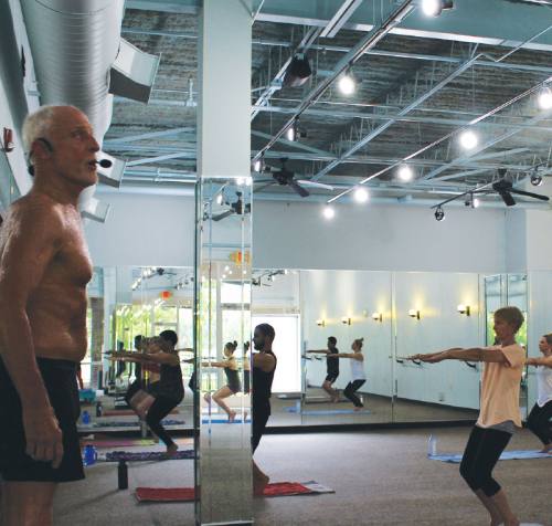 Ronnie Schreiber leads an afternoon original hot yoga class.