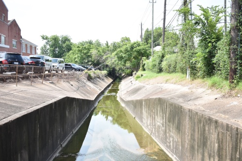 Poor Farm Ditch will become the subject of negotiations between the Harris County Flood Control District and the cities of Southside Place and West University Place.
