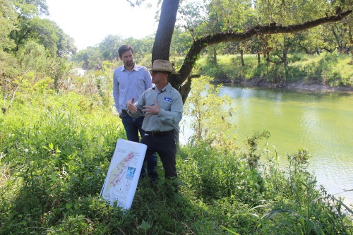 City Water employee Kevin Thuesen, right, led Austin city staff, including City Manager  Spencer Cronk in a tour of the city's water quality-protected lands.