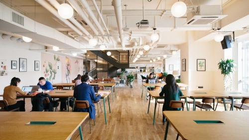 WeWork's Hughes Landing office will include a coworking hot desk area similar to this space at another WeWork location.