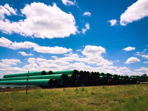 Materials for the Permian Highway Pipeline are stacked in Blanco County.