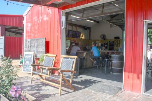 An indoor area at Rosehill Beer Gardennprovides guests with a shaded area to order drinks.