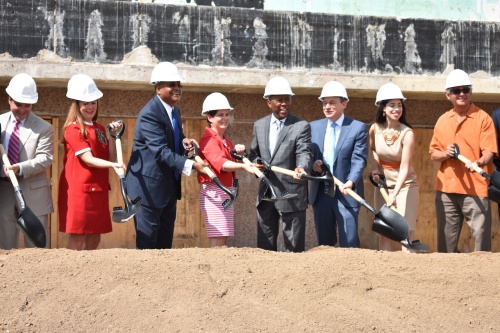 Government, business and academic officials shovel dirt at the groundbreaking ceremony for The Ion on July 19, 2019.