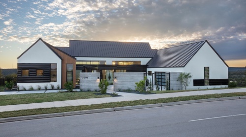 This Glazier Home's house features a modern farmhouse style. 
