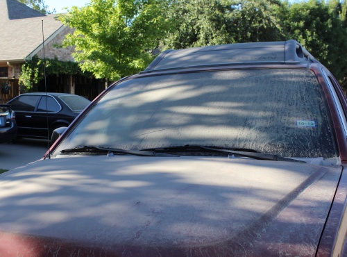 Dust that the city of McKinney says came from concrete plant Martin Marietta covers a car in a nearby neighborhood.