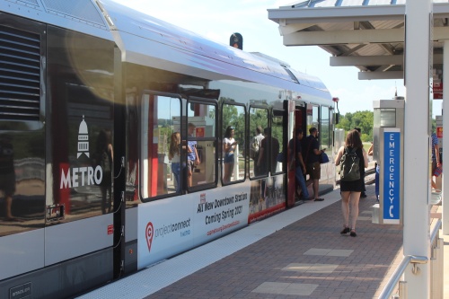 People exit the MetroRail at Leander Station on July 17.
