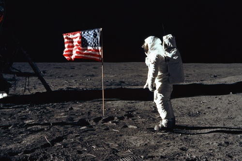 Astronaut Buzz Aldrin, lunar module pilot of the first lunar landing mission, poses for a photograph beside the deployed U.S. flag during an Apollo 11 extravehicular activity on the lunar surface. 