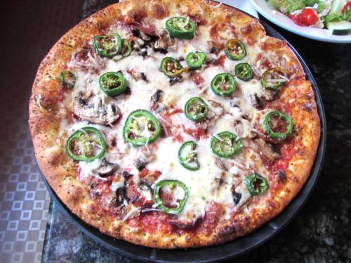 The Wild Boar is a pepperoni pizza with jalapenos and two types of cheese.