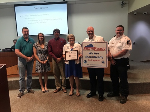 Representatives with the National Weather Service present the city of Highland Village with a StormReady certificate at a July 23 City Council meeting. 