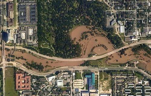 Satellite photos show Buffalo Bayou flowing with runoff from Hurricane Harvey flooding in 2017.