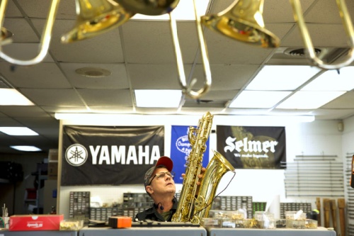 James B. Sinkule Jr., a 23-year technician and woodwind specialist with Williamson Music 1st, performs a routine sound and play check on a baritone saxophone. nPhotos by Liesbeth Powers/Community Impact Newspaper