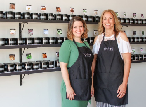 Co-owner Erica Hoke, left, along with her husband, Jeff, and General Manager and sister-in-law Jennifer Paske, right, opened Foxfire Candle Works in June.