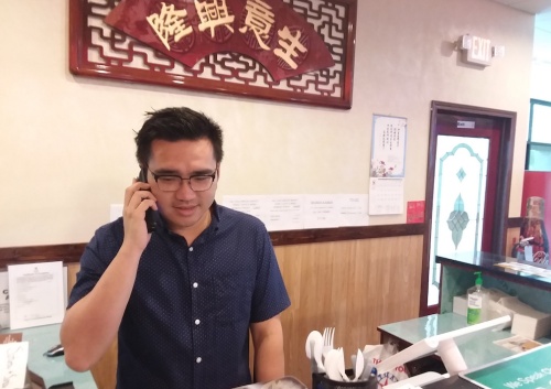 Star Buffet Manager Andy Ni takes a call at the new restaurant on Whitestone Boulevard in Cedar Park.