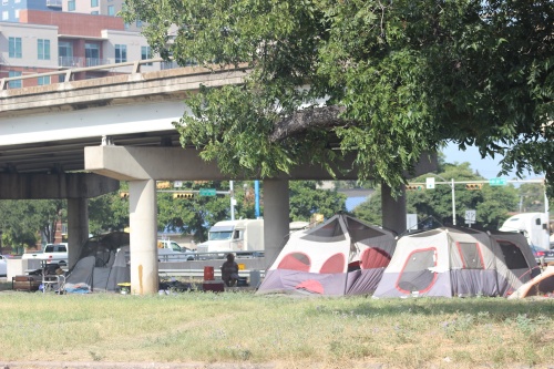 Homeless camps have become a fixture under highways such as I-35. 