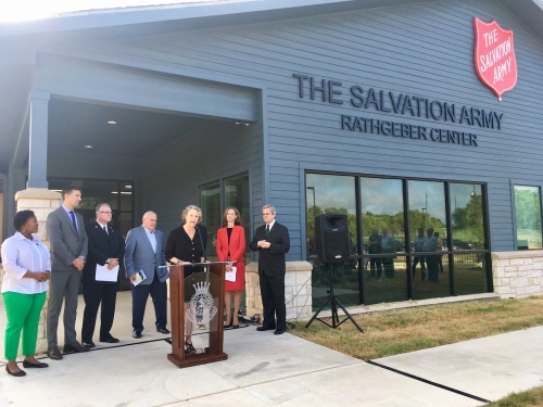 Molly Alexander, executive director of the Downtown Austin Alliance Foundation, announces her foundation's fundraising campaign for the Salvation Army's Rathgeber Center. The new facility is a 212-bed homeless shelter for families with children that has faced delayed openings due to funding gaps. 