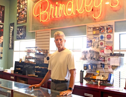 Bruce Brindley has been working at Brindleyu2019s Music Center since he was a sophomore in high school. Now in his fifties, Brindley is the owner and operator of the downtown music shop. n