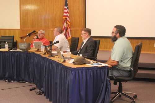 From left: Mayor Pro Tem Bill Foulds, Mayor Todd Purcell, Council Member John Kroll and Council Member Travis Crow consider the city's budget at their Sept. 17 meeting.