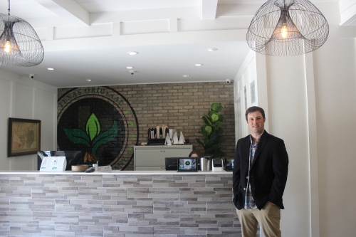 Mike Rubin, co-founder and vice president of business development for Compassionate Cultivation, stands in the company's dispensary.