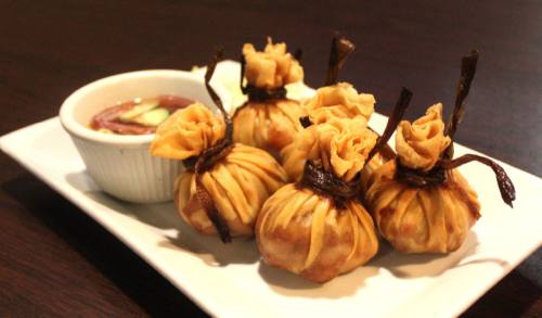 The Golden Bags appetizer is deep-fried diced chicken, sweet potato, yellow onion and curry powder wrapped with rice paper.