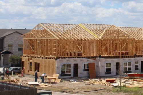 Workers build homes in Leander in this October 2019 photo.