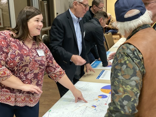 Lakeway Building and Development Services Director Charlotte Hodges explains a potential road project to an attendee at an Oct. 29 open house. 