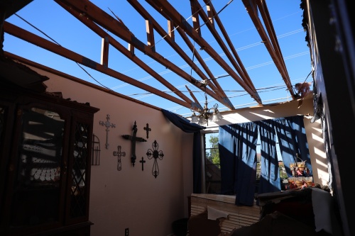 An hour after the storm blew through, moisture from the rain caused resident Cindy Dorsay's roof to collapse. (Liesbeth Powers/Community Impact Newspaper)