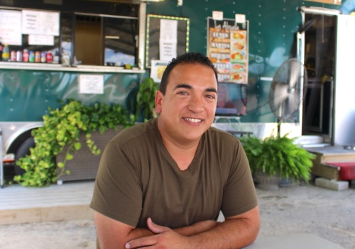 The Food Zone owner Jesse Flores sits at his motheru2019s truck, Tacos La Abuela, which serves authentic Mexican dishes.