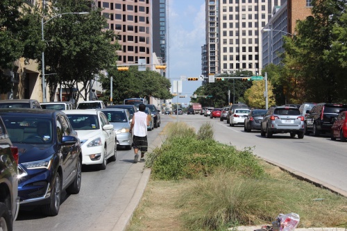 A man experiencing homelessness in downtown Austin asks for help. 